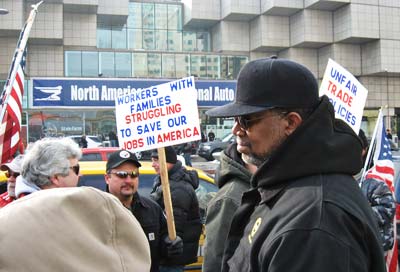 Union autoworkers and supporters protest declining conditions this January at the Detroit Auto Show.