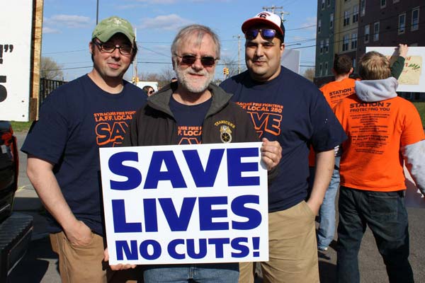 Howie Hawkins protesting with firefighters the closing of Fire Station 7 in Syracuse, NY.  Photo by Ursula Rozum